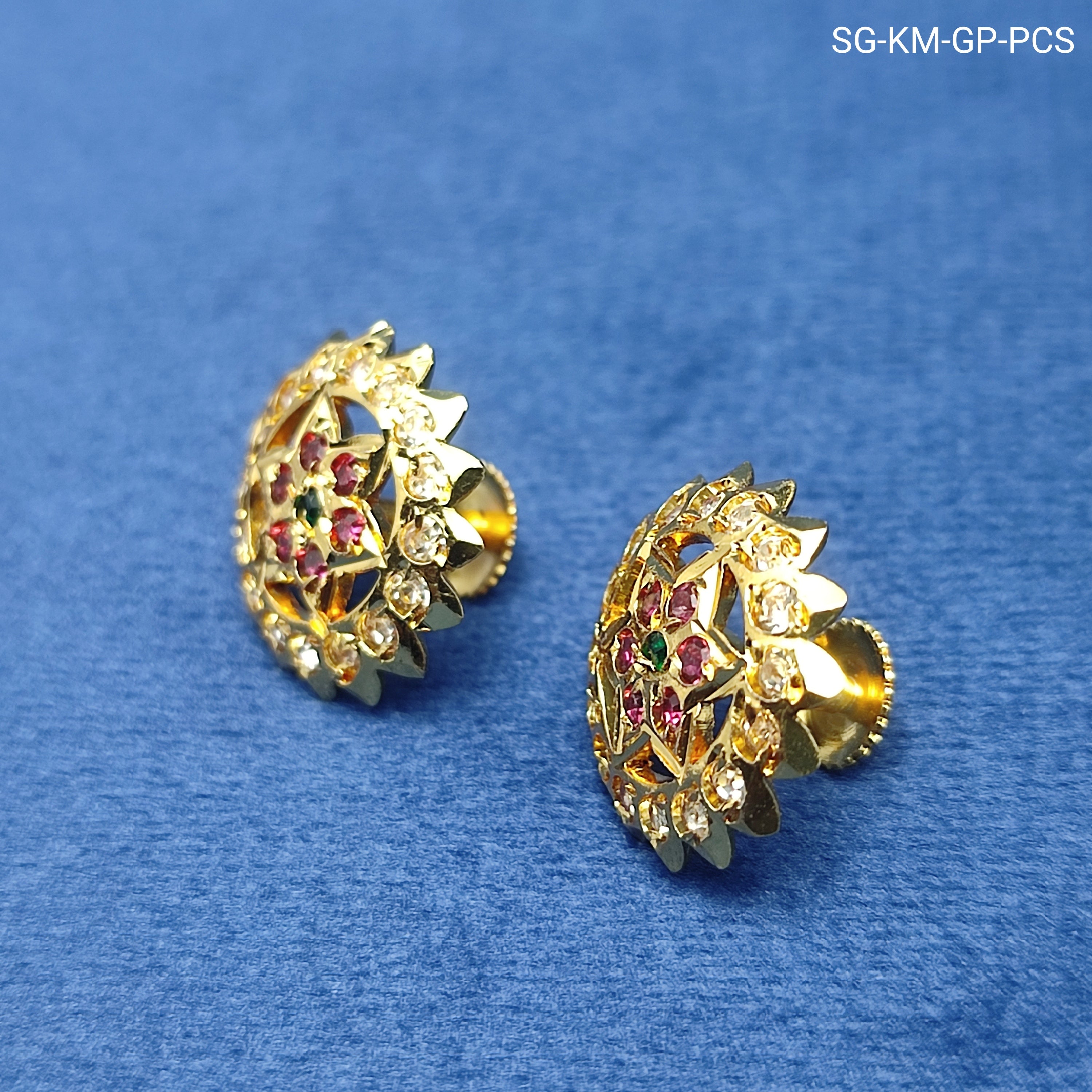 Elegant floral stud earrings  sparkling white stones and rich ruby-red stone and green stone.