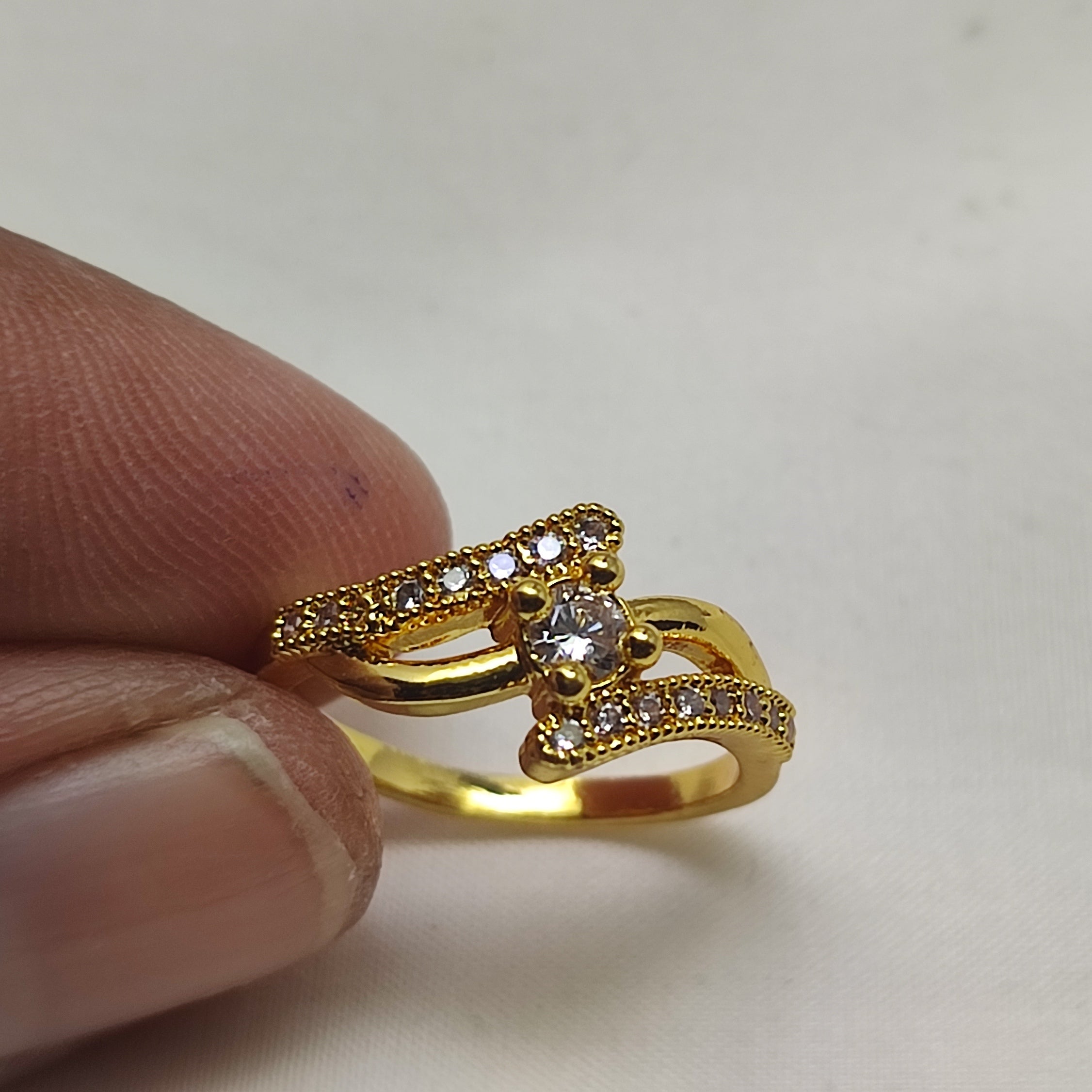 An elegant gold ring White