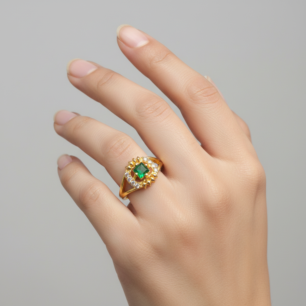 Gold plated finger ring with a vivid green square stone