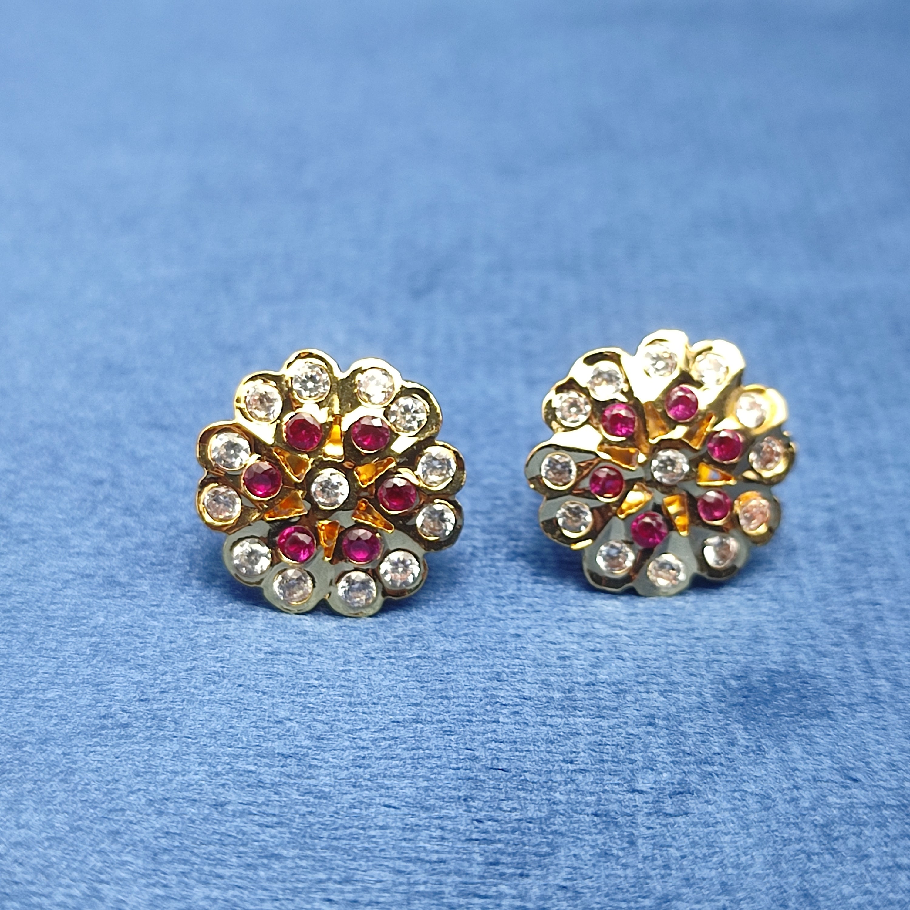 Radiant floral earrings with sparkling white stones and rich ruby-red stones