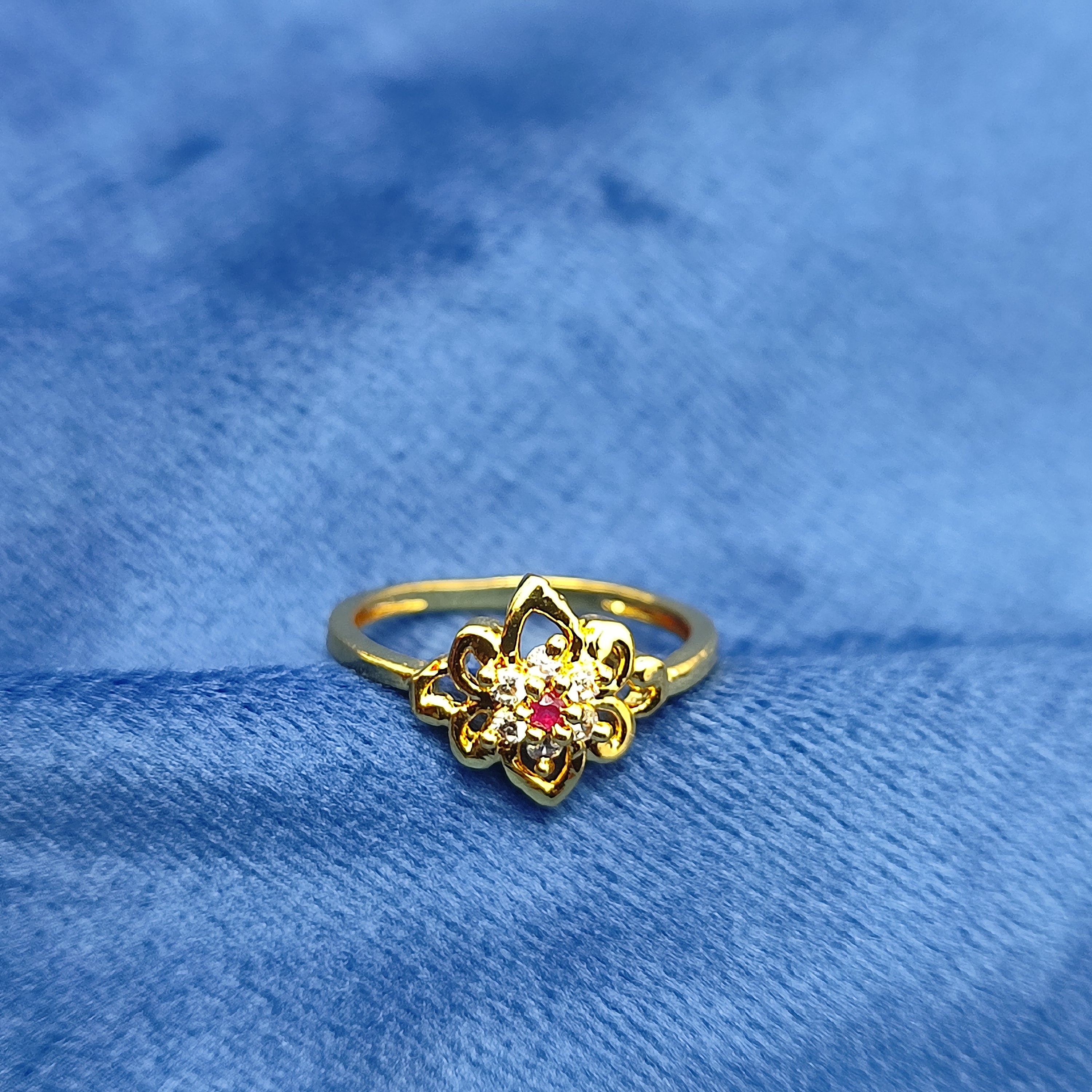 Gold plated floral Ring with red stone