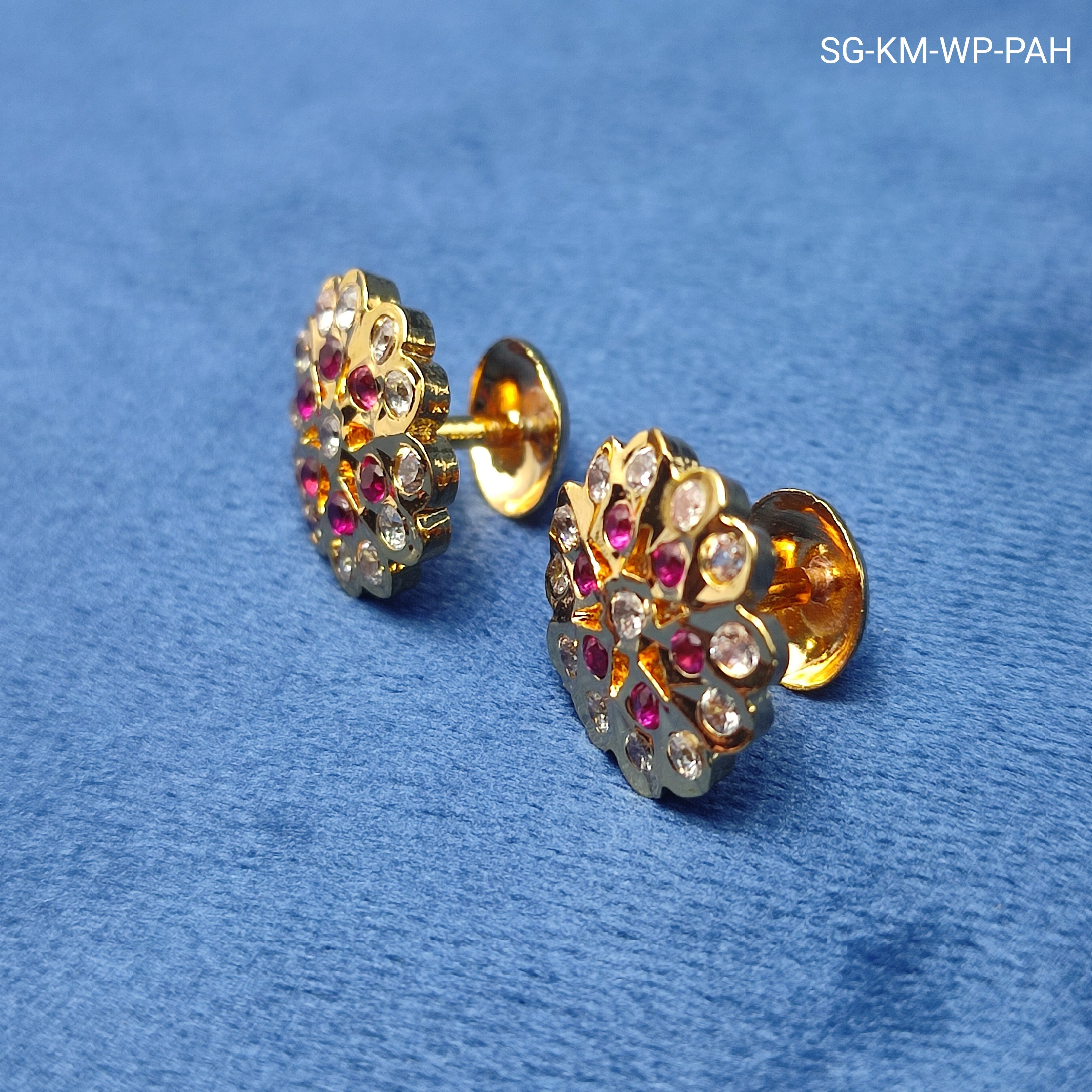 Radiant floral earrings with sparkling white stones and rich ruby-red stones
