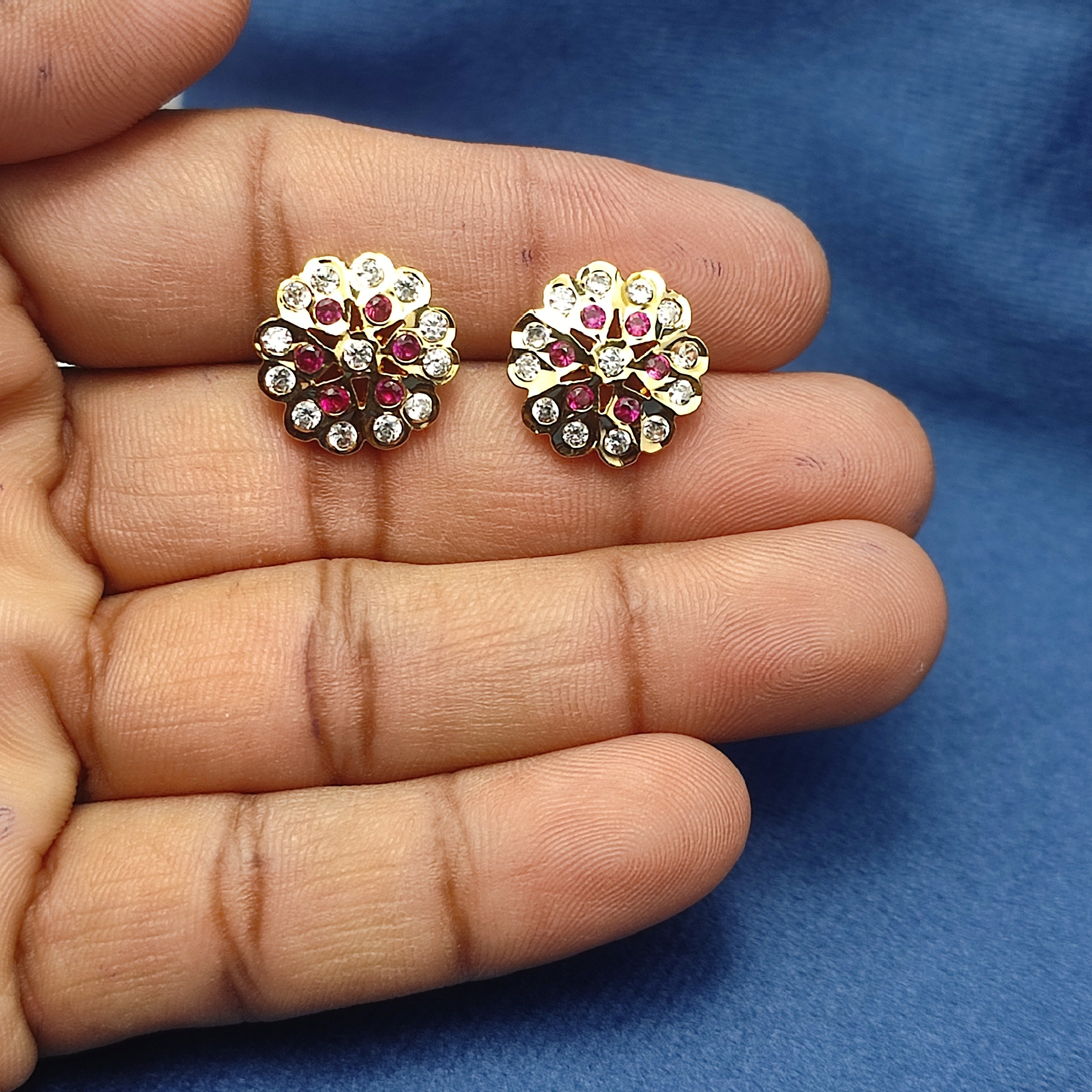 Radiant floral earrings with sparkling white stones and rich ruby-red stones